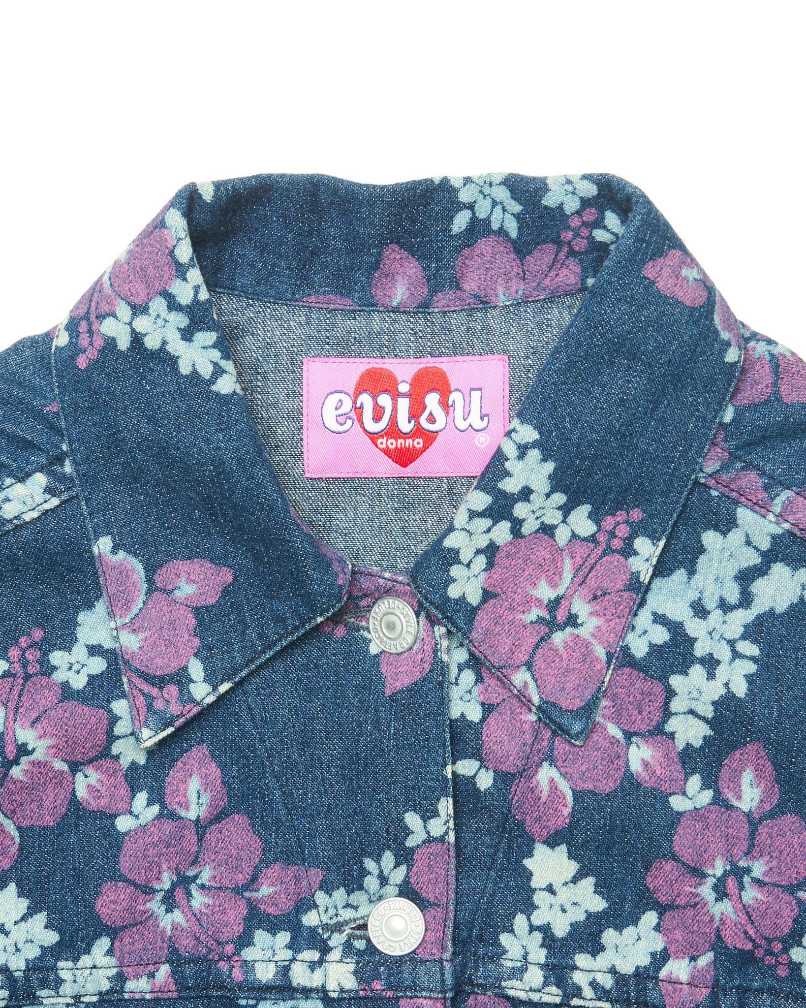 Floral denim jacket with Evisu label on a white background