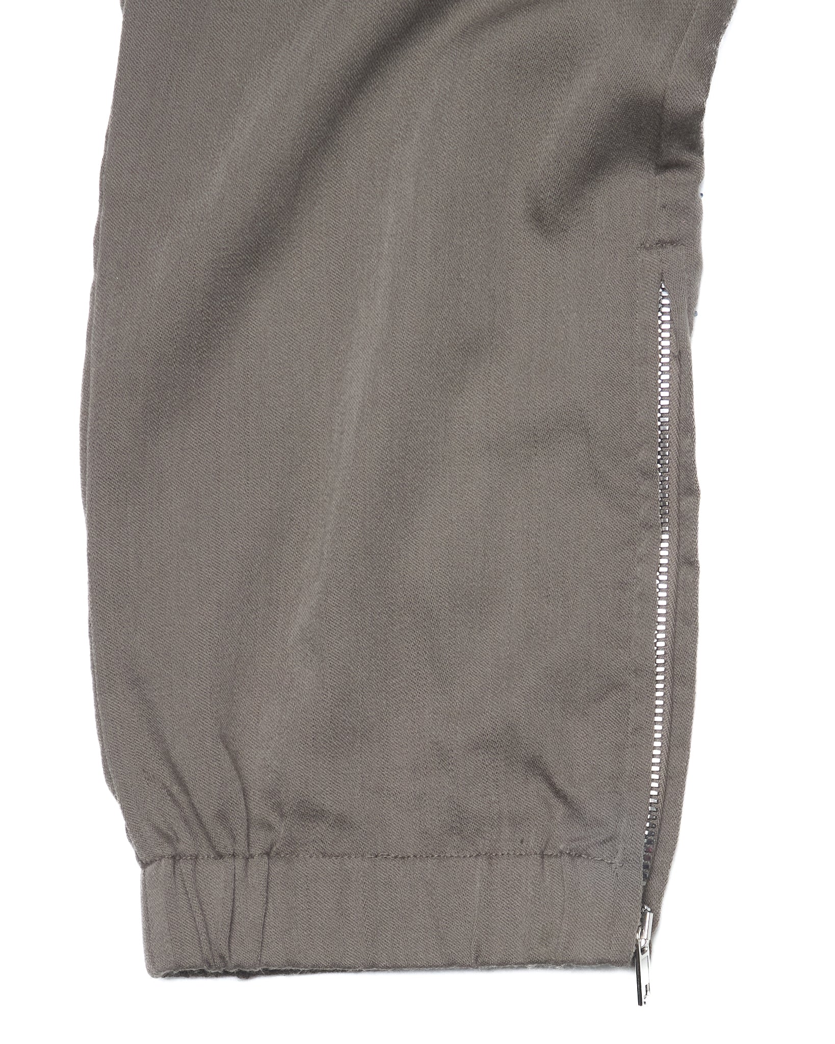 Close-up of a gray jacket with a zipper on a white background