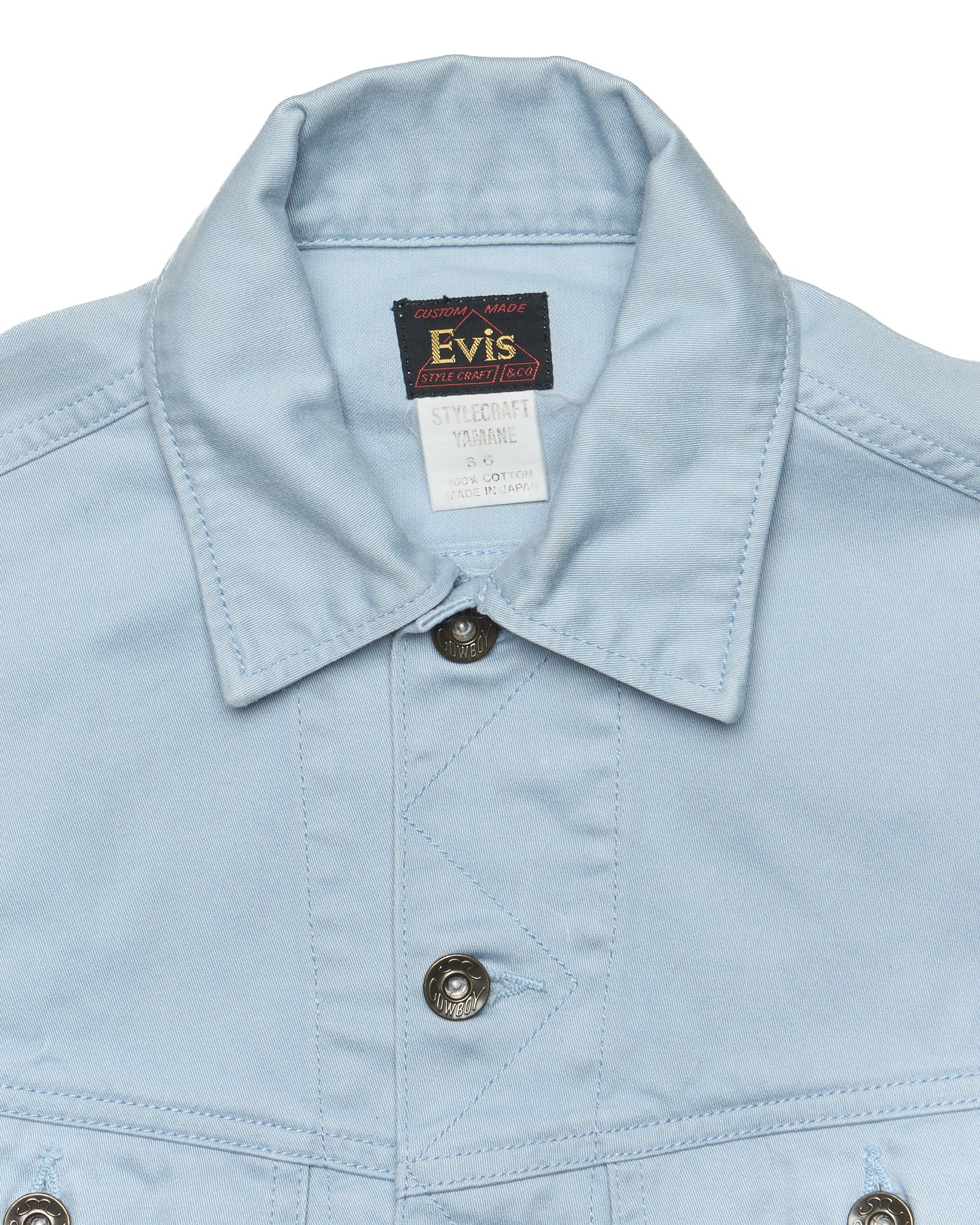 Light blue jacket collar with Evis label on a white background
