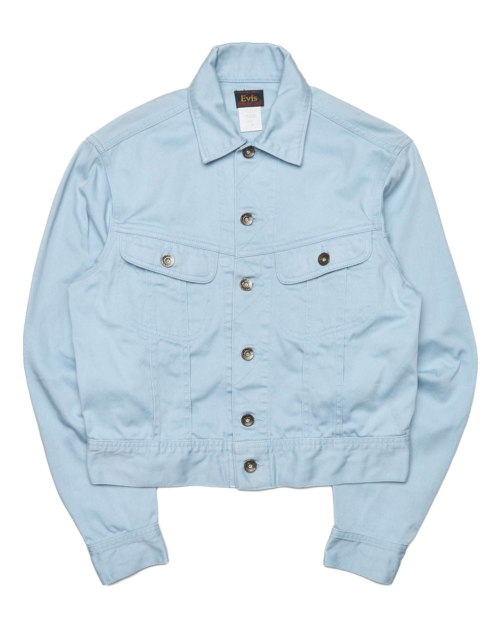 Light blue denim jacket with button details on a white background