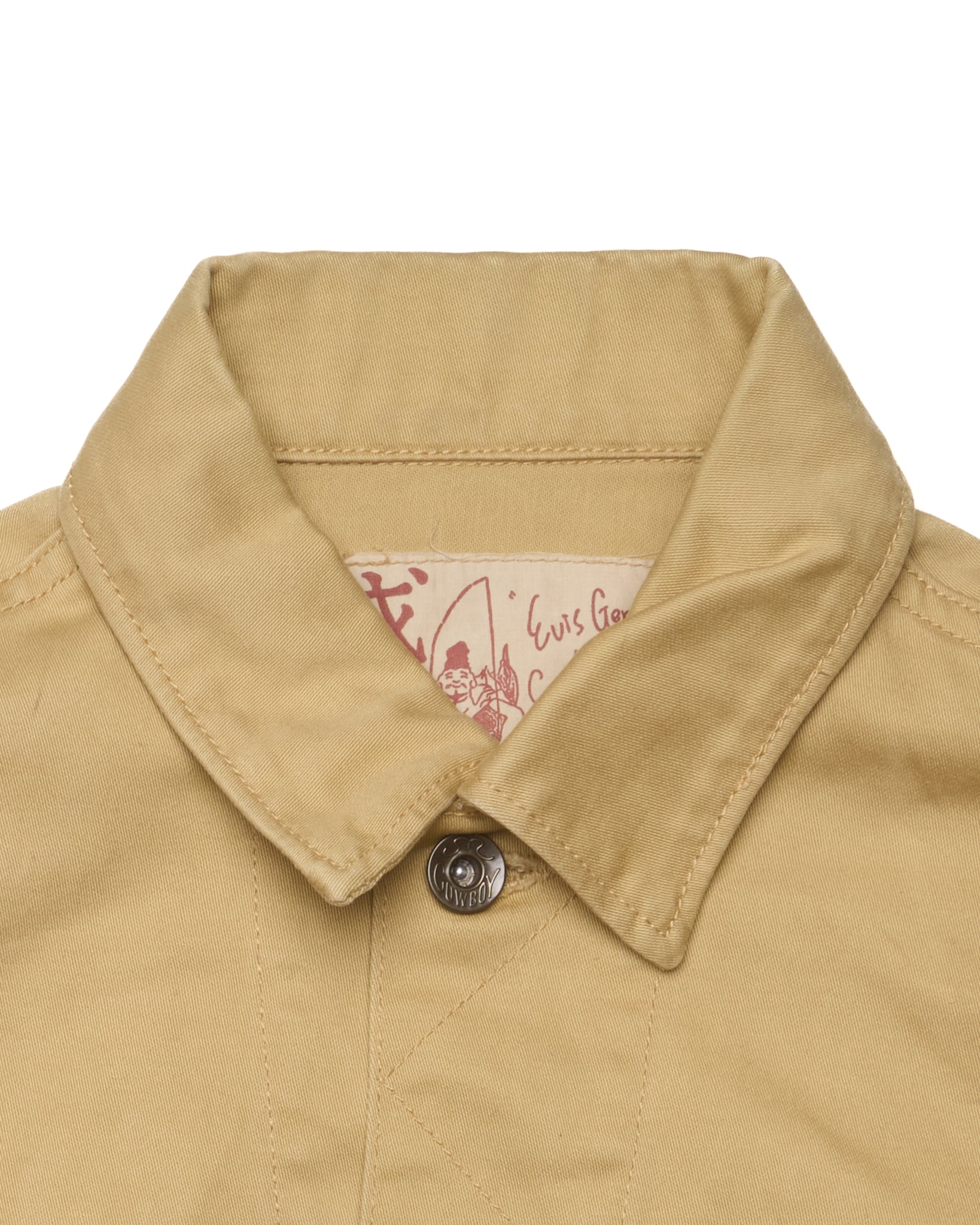Close-up of a beige jacket collar with a brand label on a white background