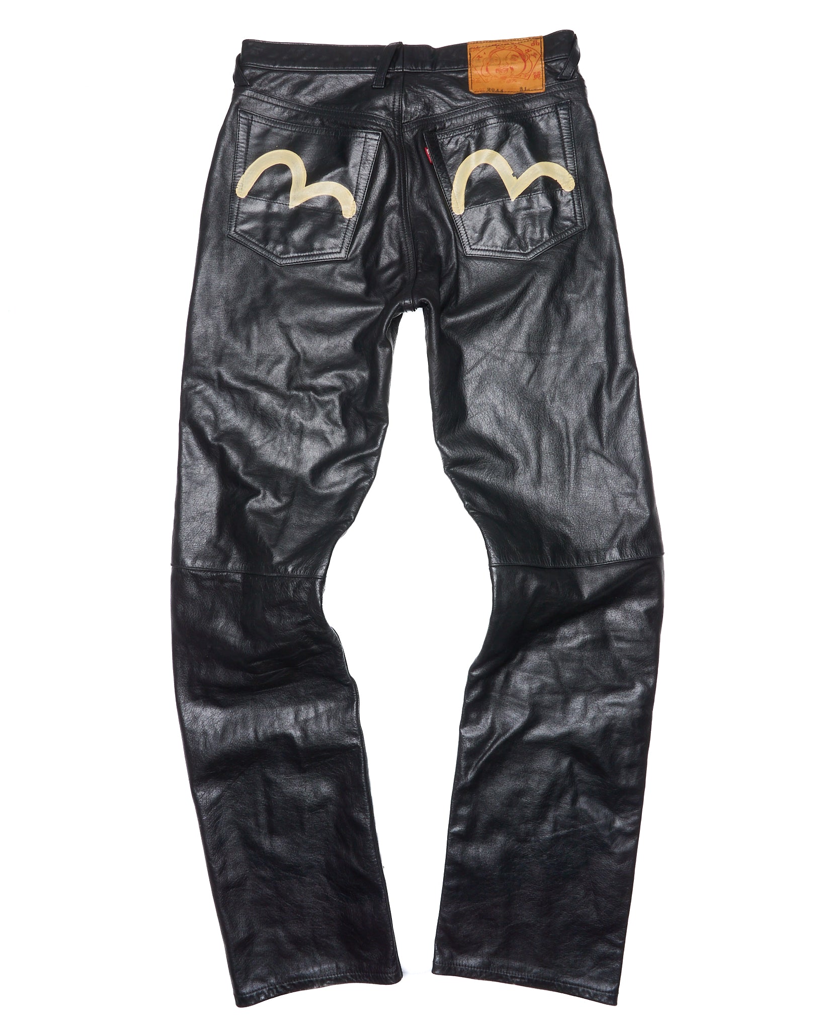 Black leather pants with decorative elements on a white background