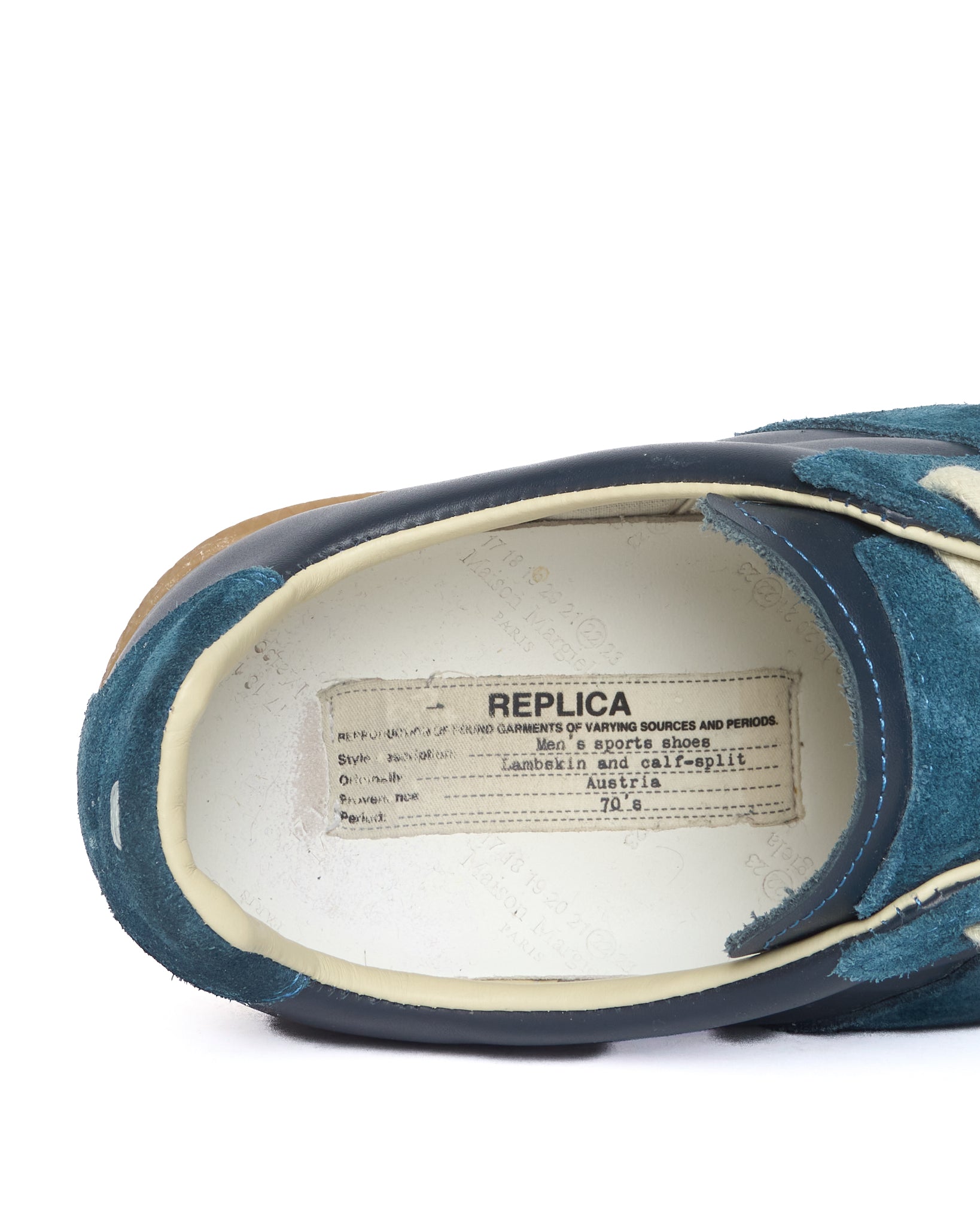 Blue shoe with a 'Replica' label on a white background