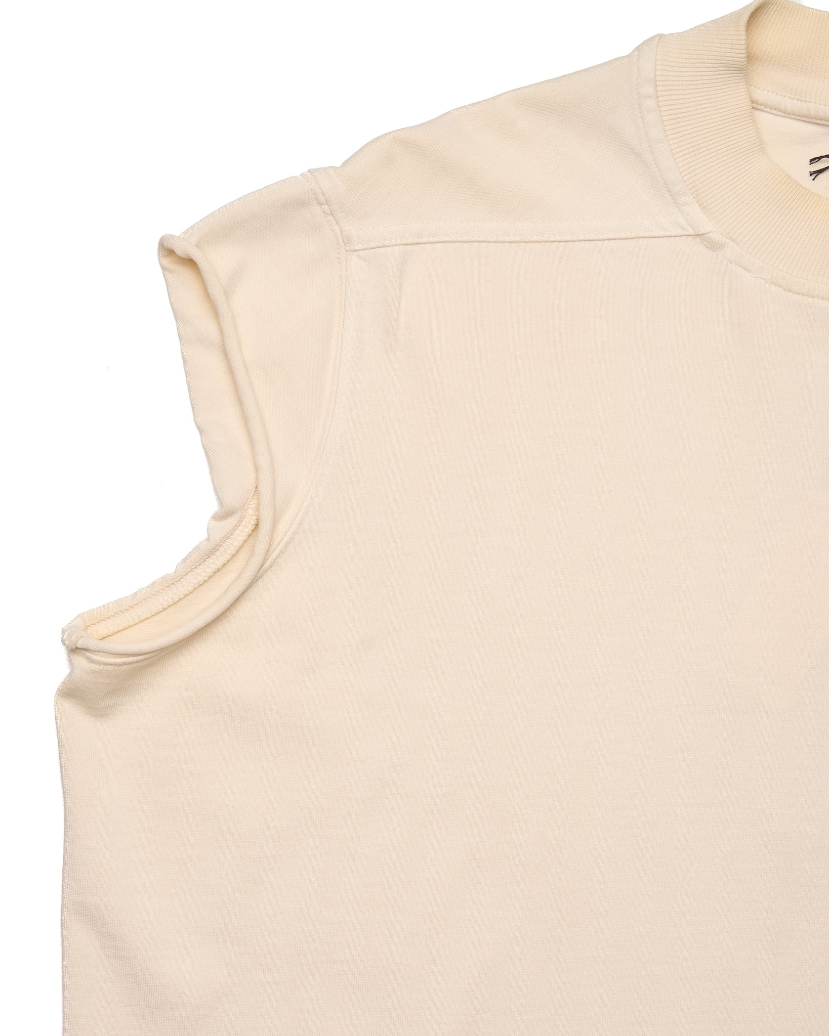 Beige sleeveless top on a white background