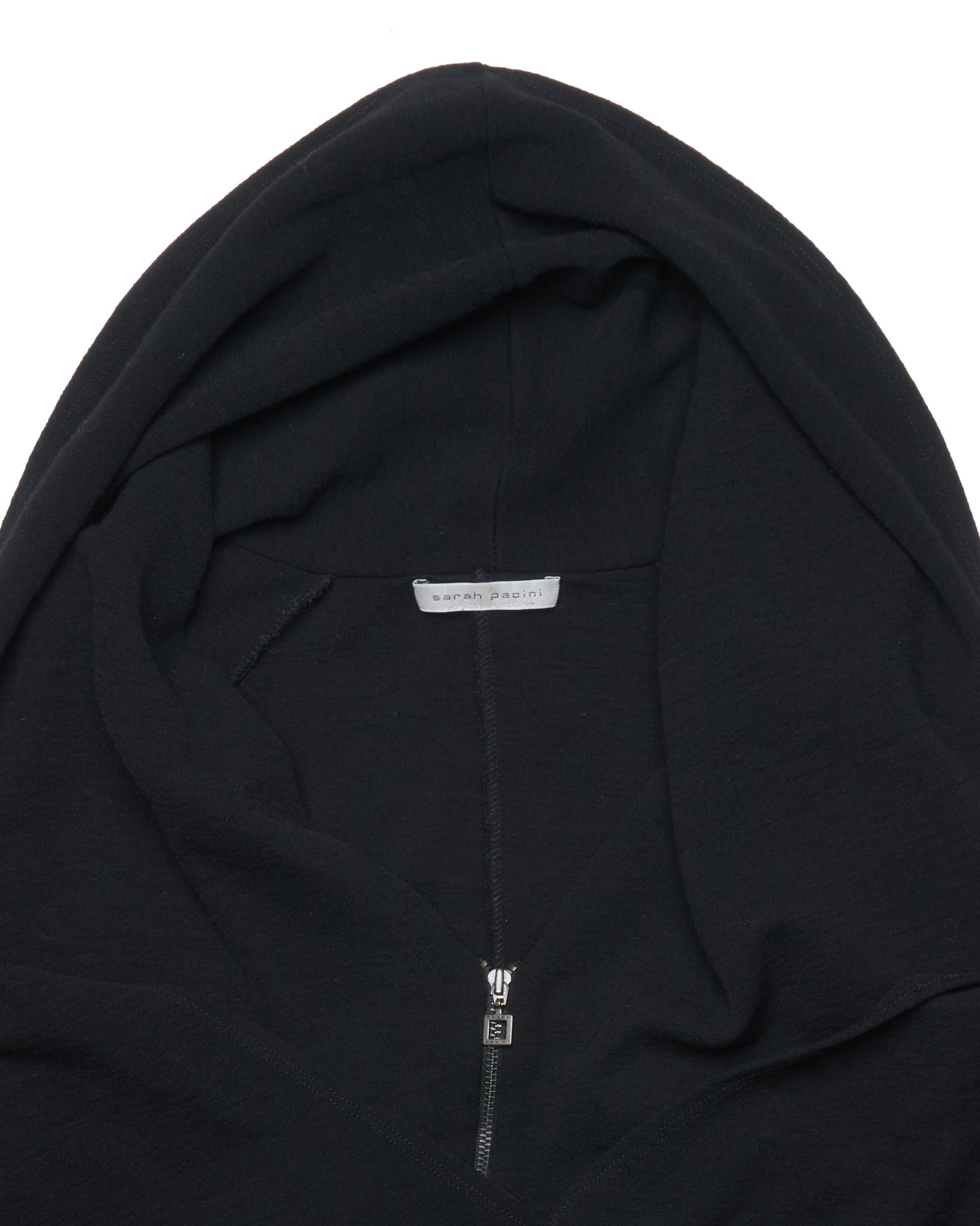 Black hoodie with a brand label on a white background