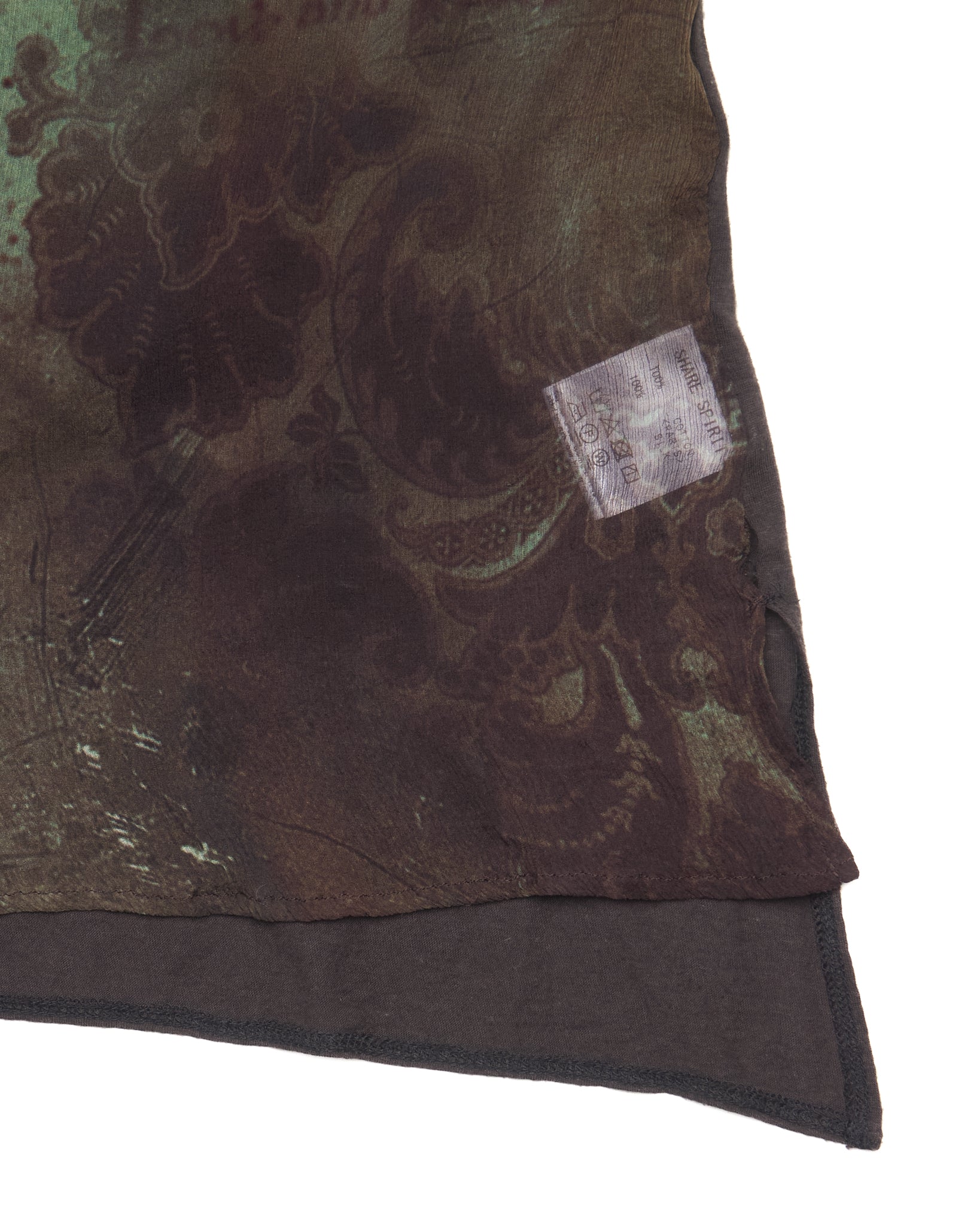 Close-up of a patterned fabric with a label on a white background