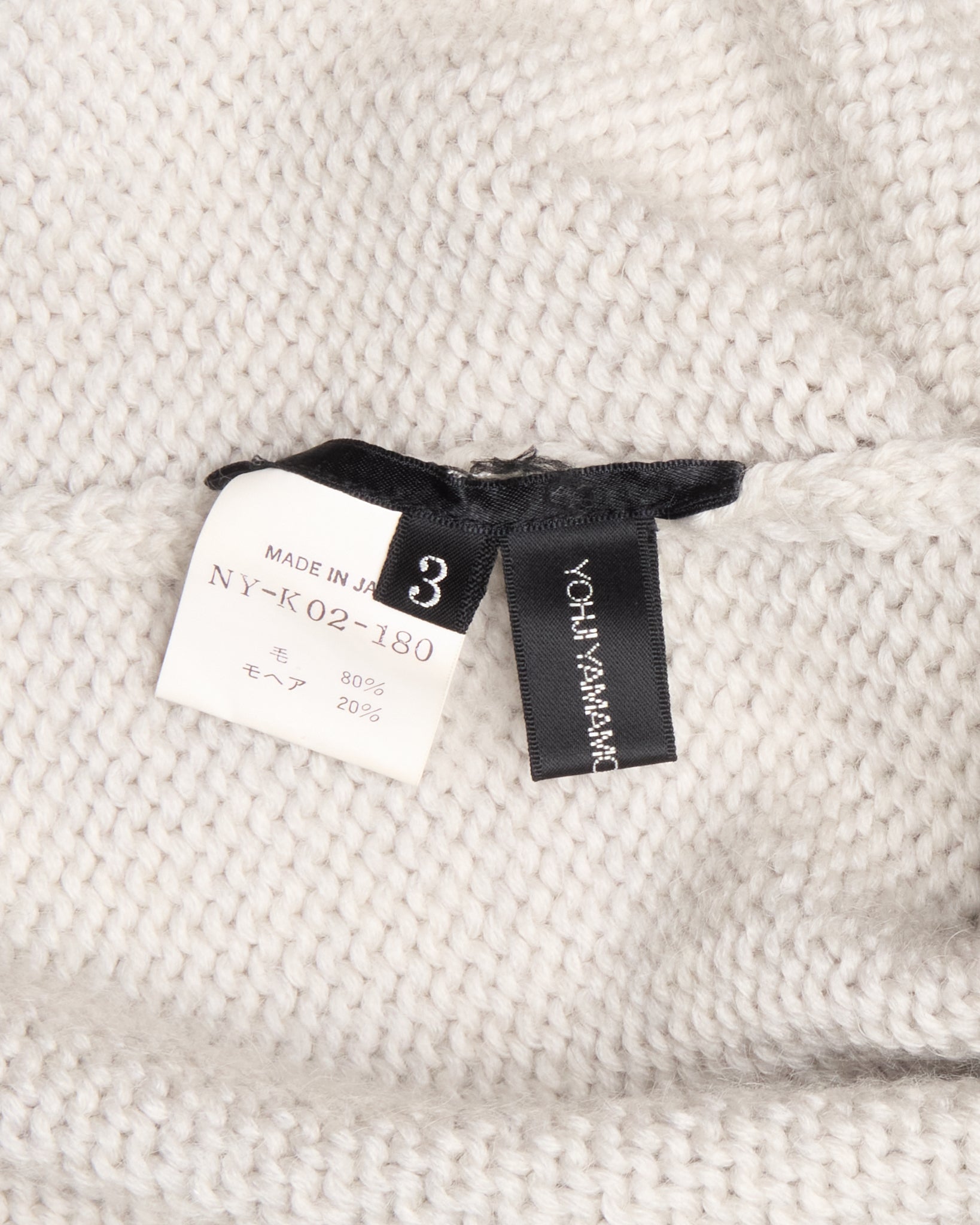 Clothing tag on a textured fabric background